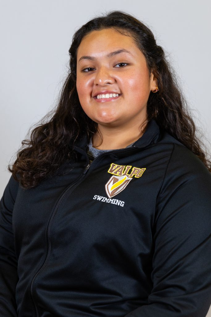 Jazzy Soria Gonzalez '24 smiling at the camera in professional attire. 