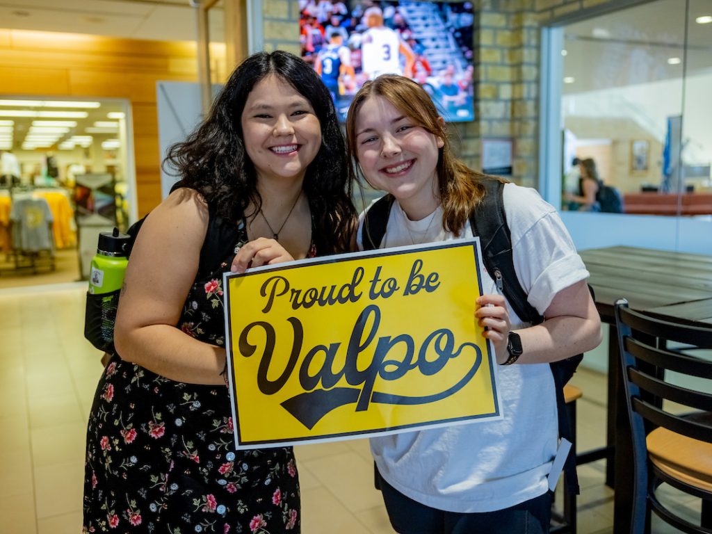 Students showing their Valpo Pride with a Proud to be Valpo sign.