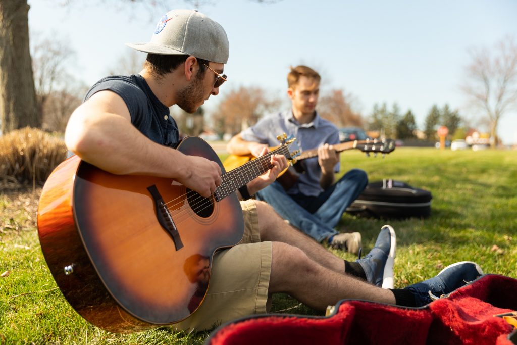 Valparaiso University enjoying guitar playing in on the university grounds.