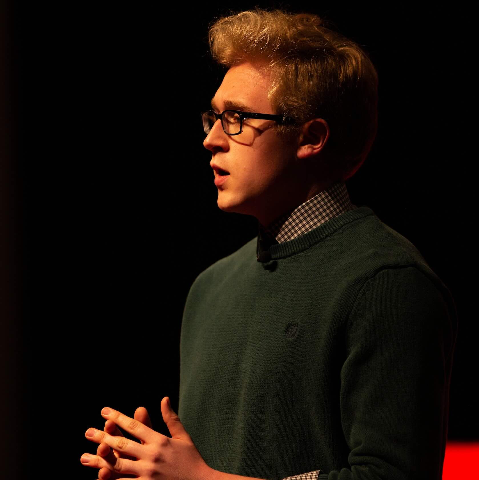 alumnus Daniel Owens '23 speaking to an audience out of frame during the TEDxValparaisoUniversity conference.