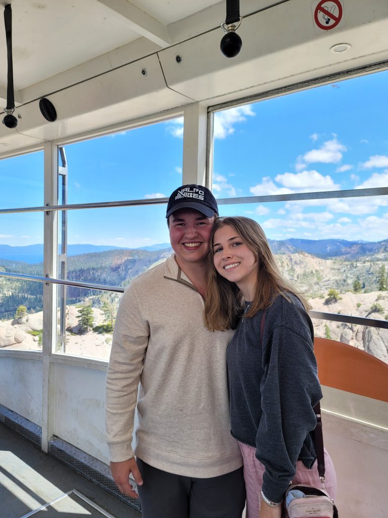 Valparaiso University physics and mathematics student Lane Scheel '25 and girlfriend smiling.