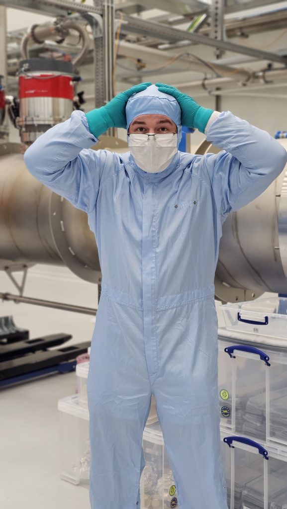 Valparaiso University physics and mathematics student Lane Scheel '25 in lab attire.