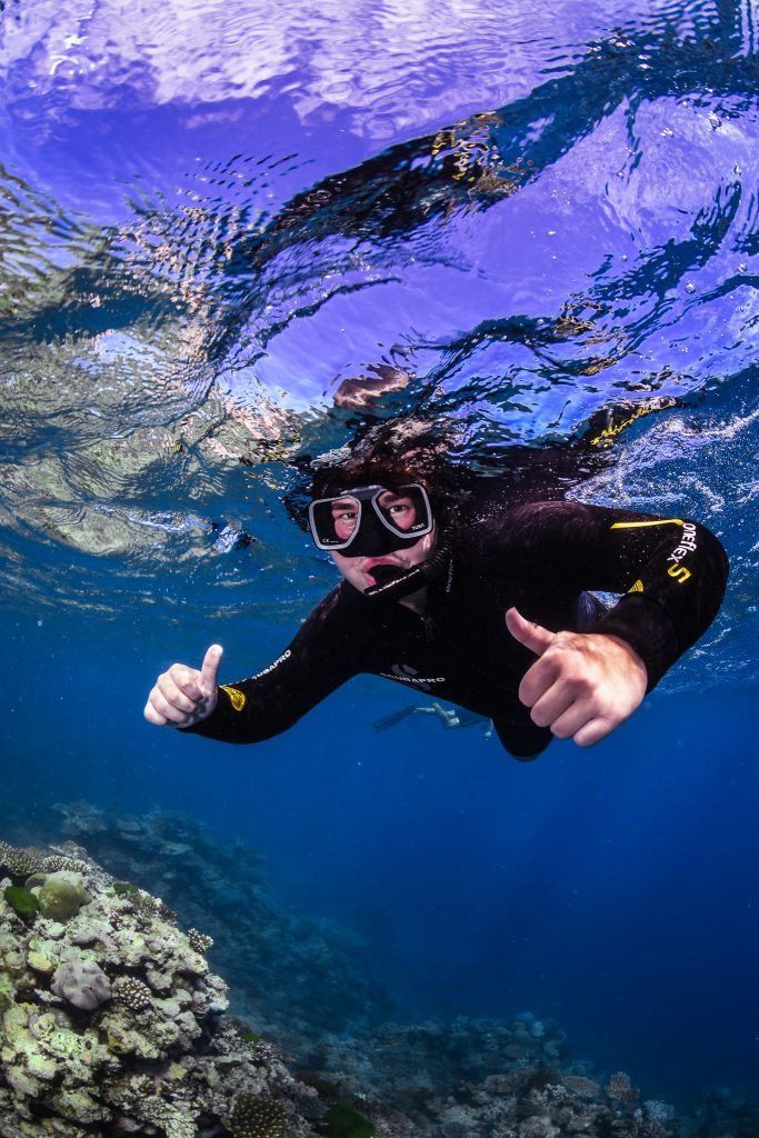 Valparaiso University physics and mathematics student Lane Scheel '25 snorkeling.