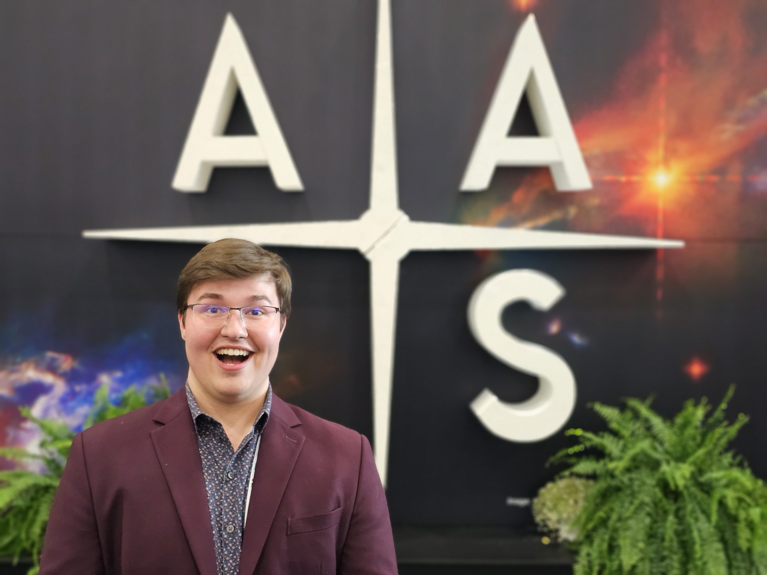 Valparaiso University physics and mathematics student Lane Scheel '25 smiles in professional attire.