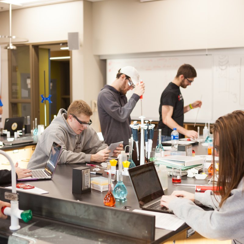 Valpo students conducting experiments in a chemistry lab